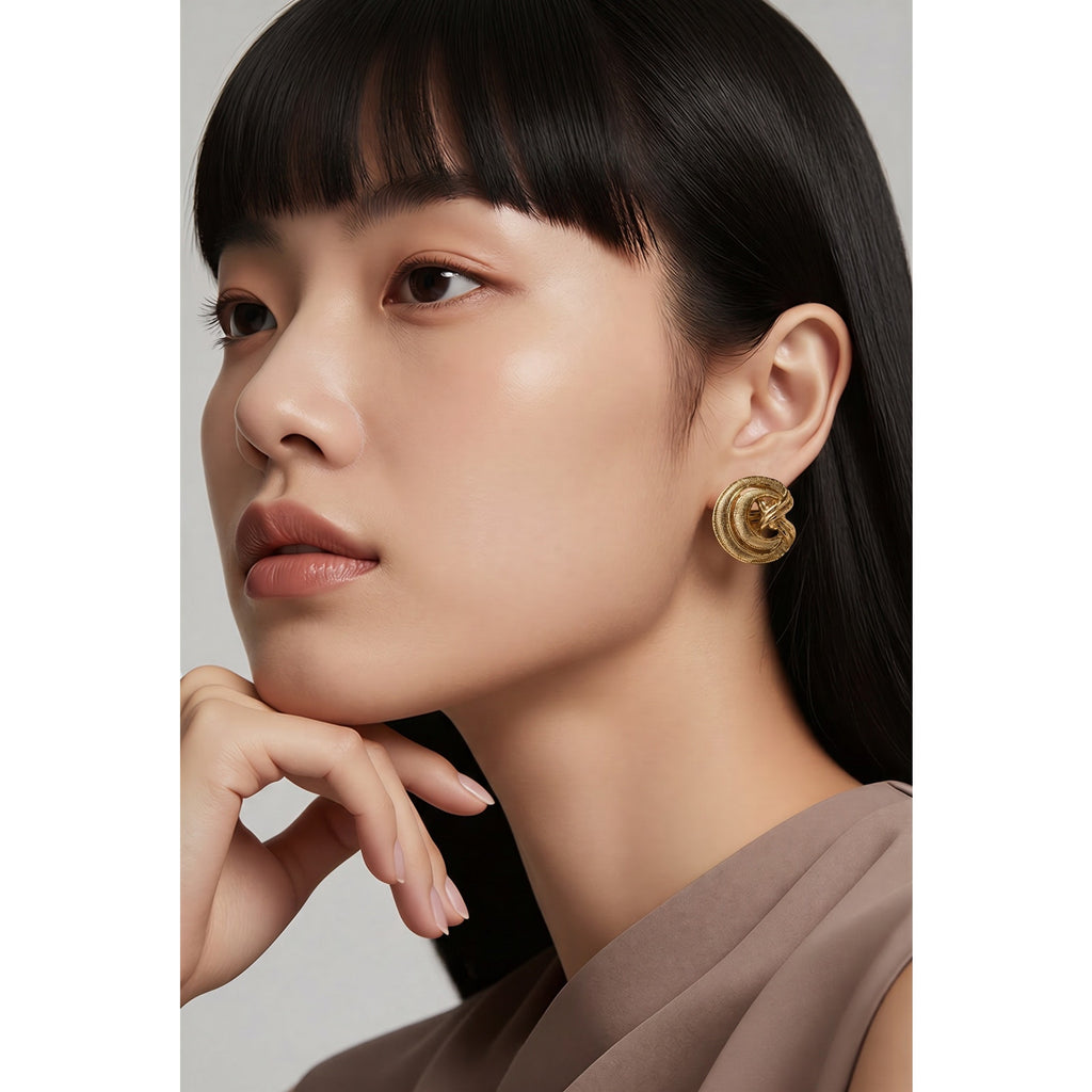 The Vivienne Clip — Chunky Interlocking Gold-Plated Textured Love Knot Earrings