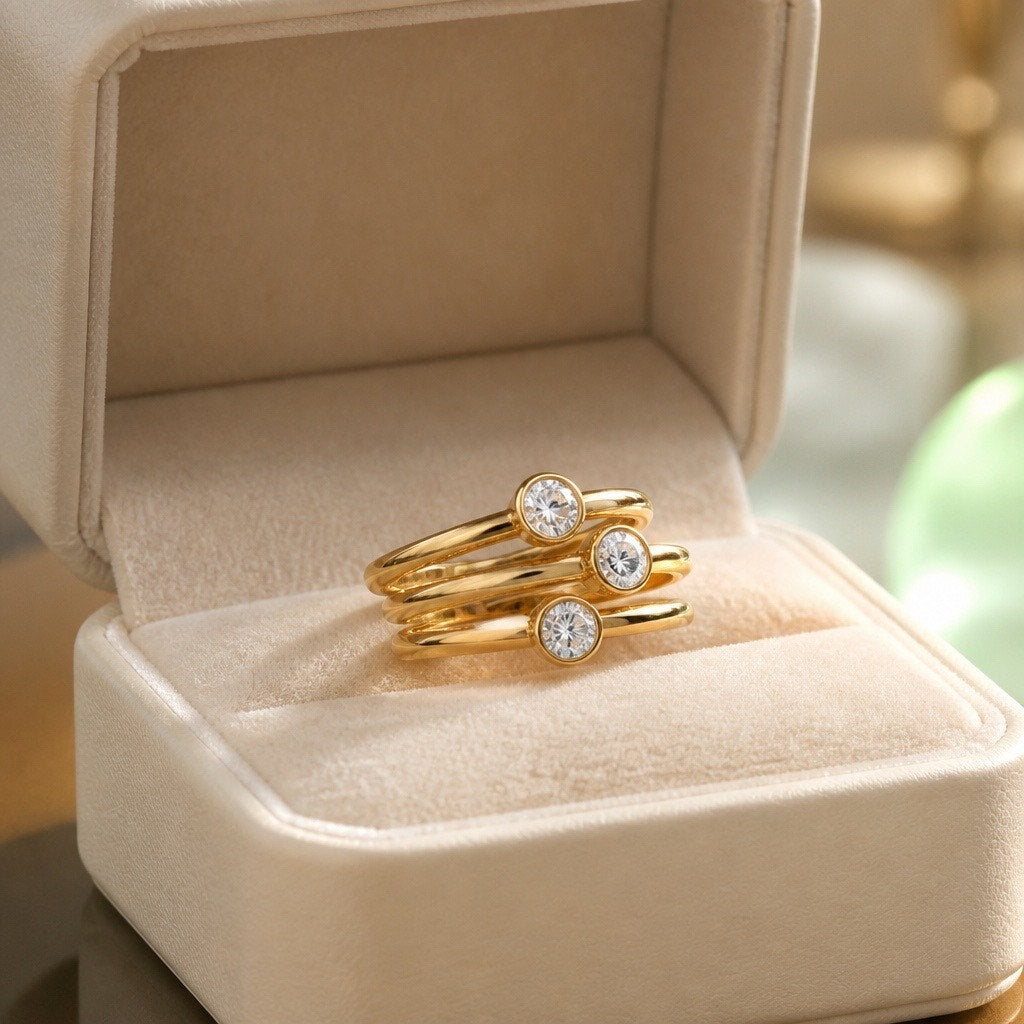 Elegant Triple Band Ring in Gold with Three Clear Stones